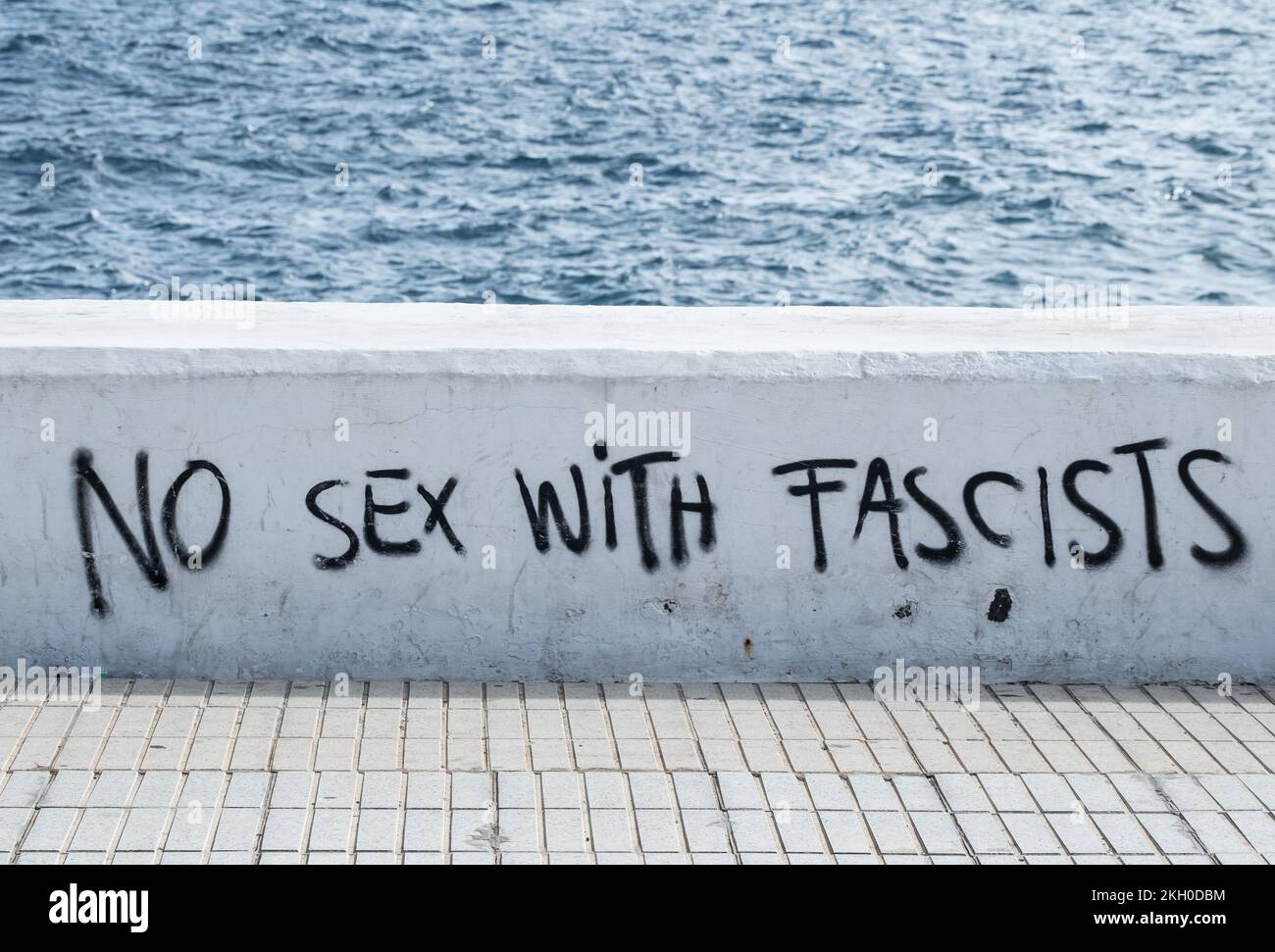 No sex with fascists graffiti on sea wall. Stock Photo