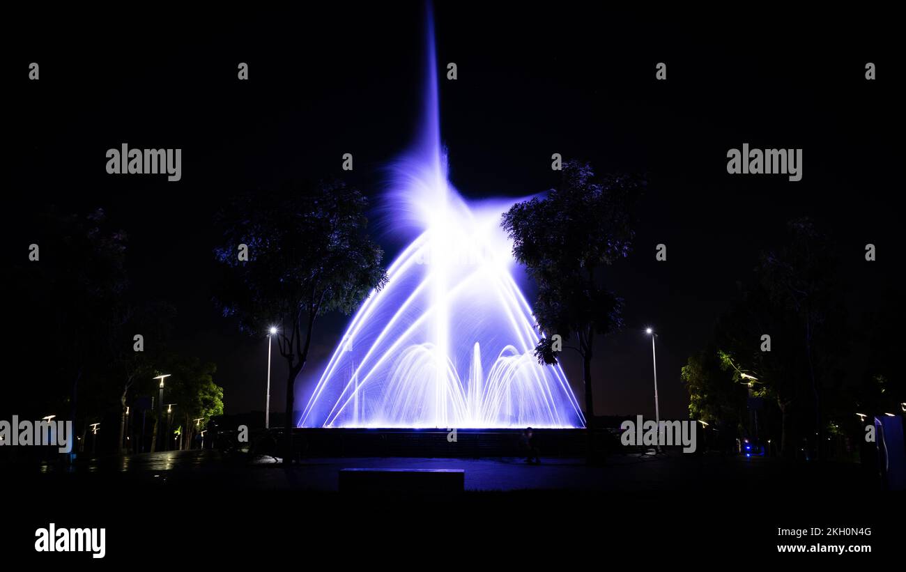 A long exposure shot of an illuminated fountain at night Stock Photo ...