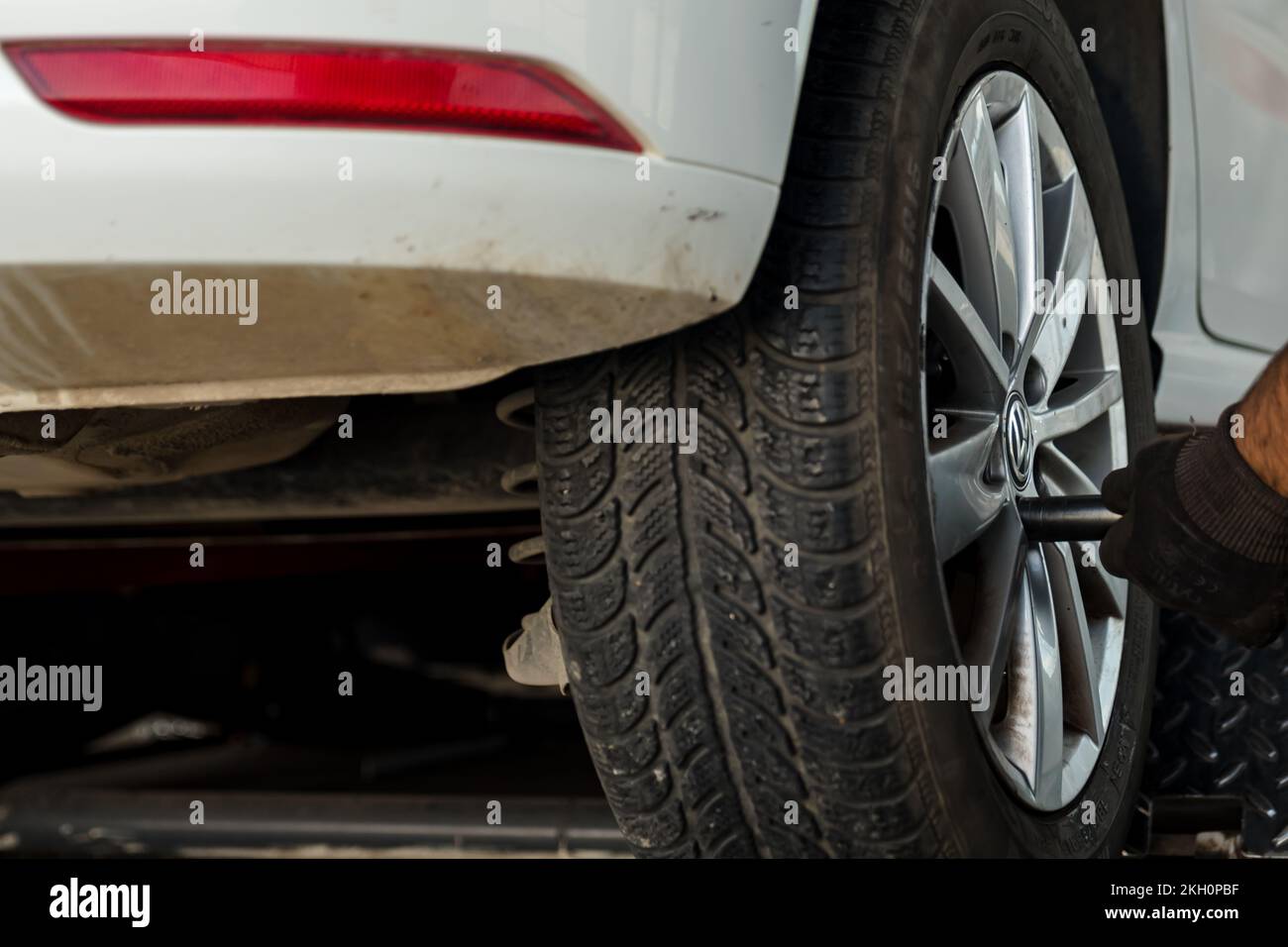 Tire installation concept. Winter and summer car tires. Seasonal winter