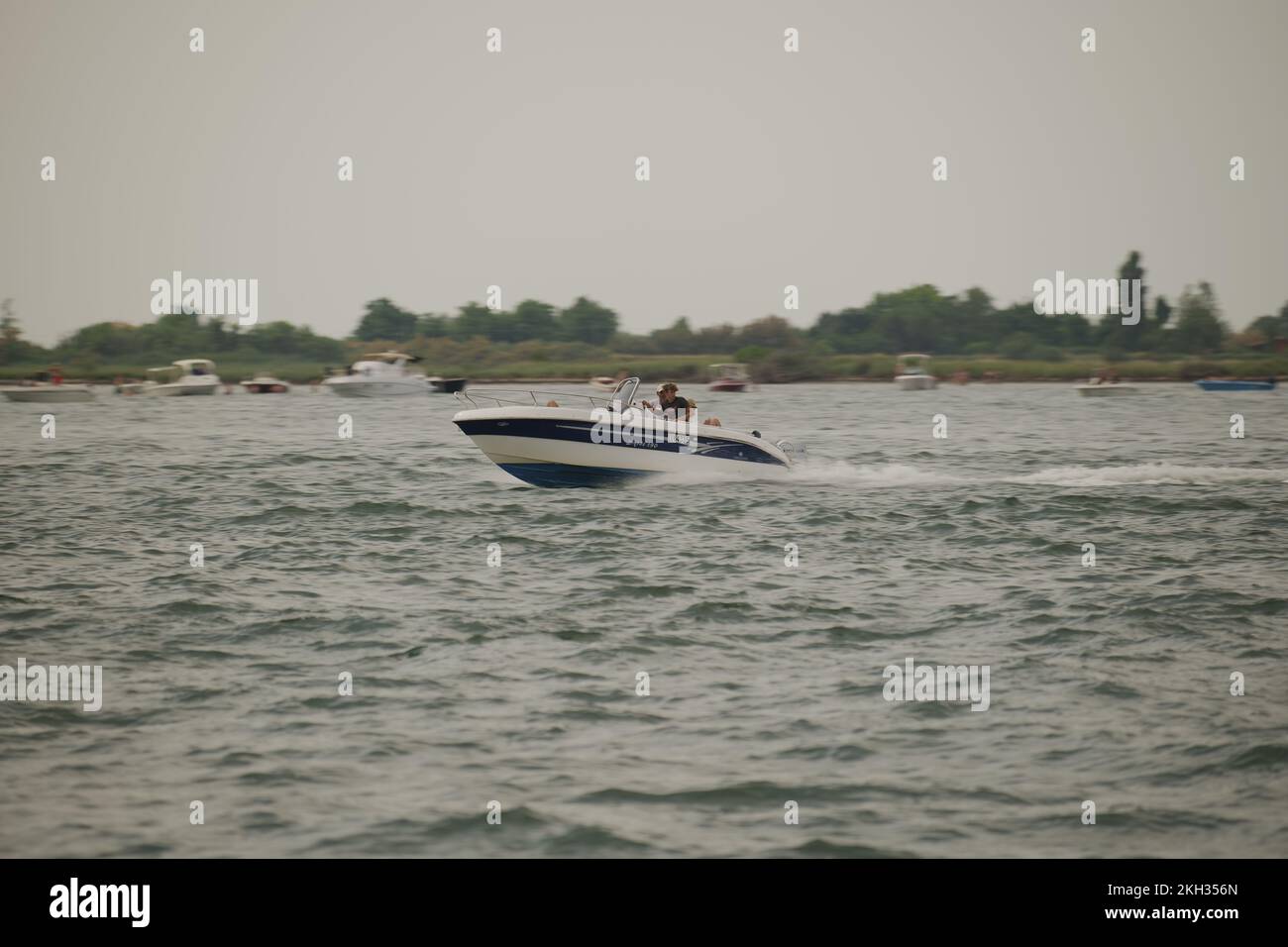 Man riding in a boat hi-res stock photography and images - Alamy