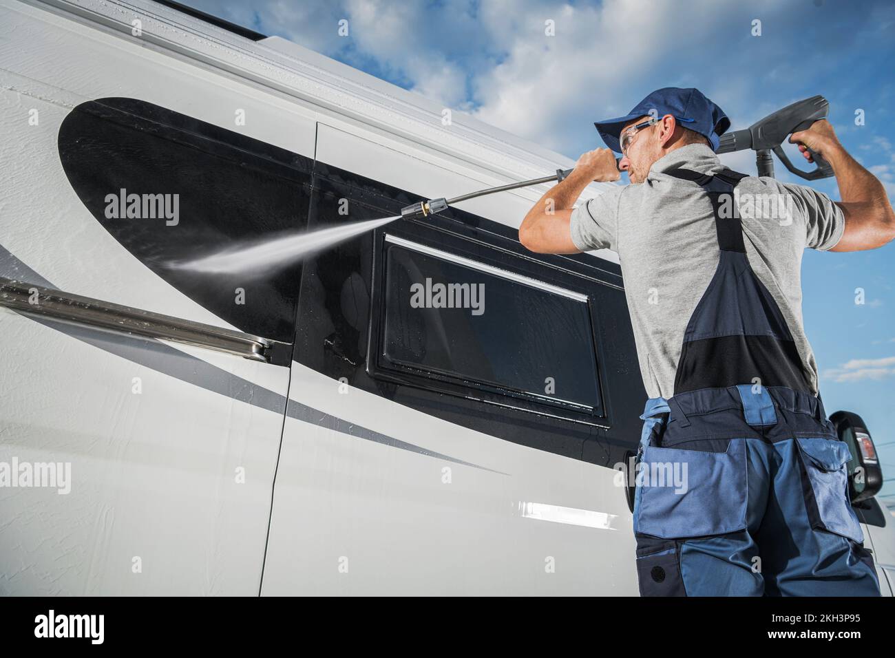 Professional Caucasian Car Detailing Services Worker Cleaning the