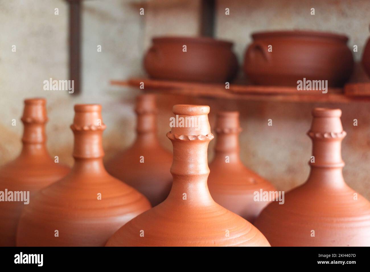 Pottery, ceramic and handmade products on a shelf in a and