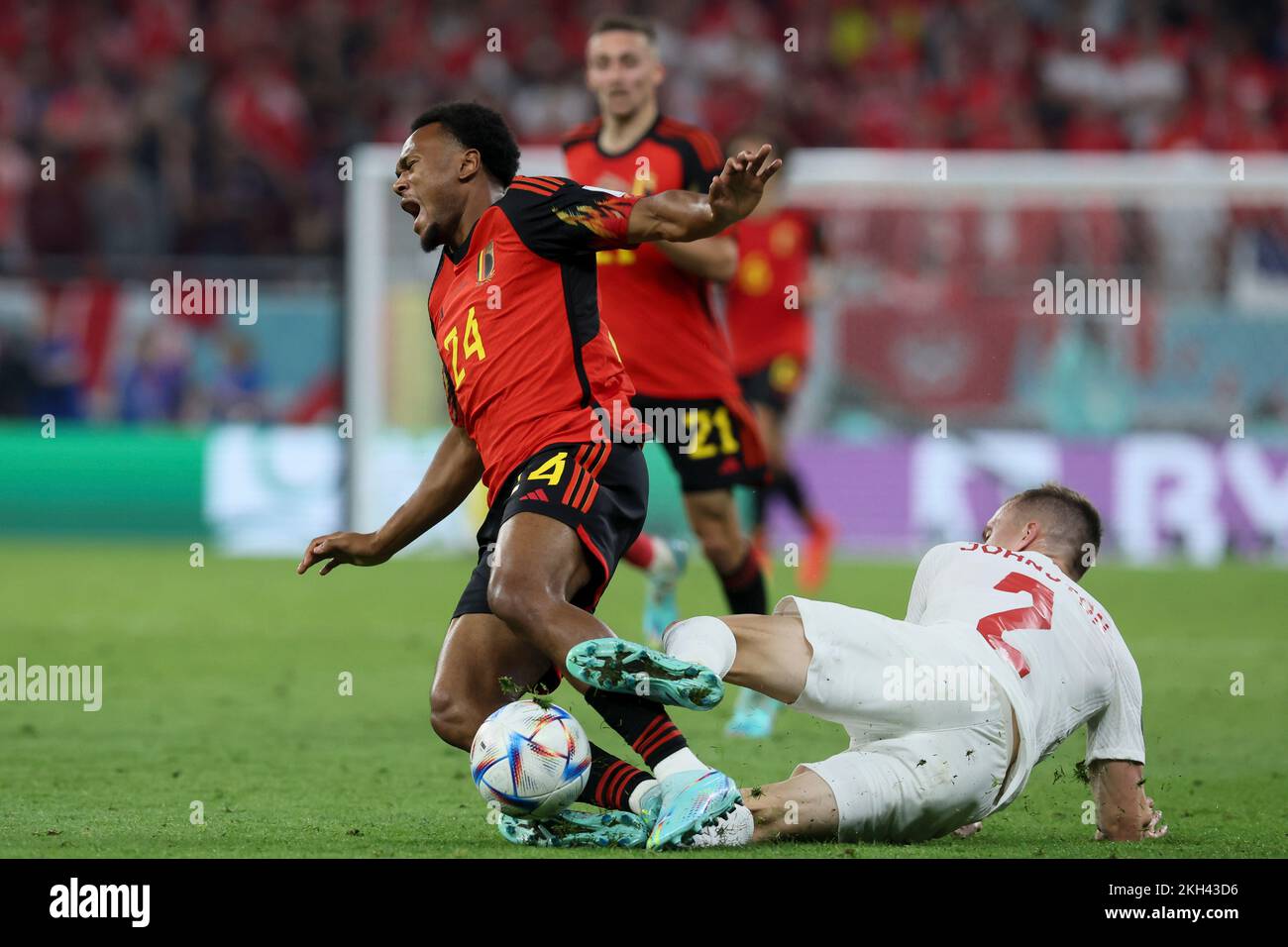 Al Rayyan, Qatar. 23rd Nov, 2022. Belgium's Lois Openda in action and Canadian Alistair Johnston gets a yellow card for this tackle at a soccer game between Belgium's national team the Red Devils and Canada, in Group F of the FIFA 2022 World Cup in Al Rayyan, State of Qatar on Wednesday 23 November 2022. BELGA PHOTO BRUNO FAHY Credit: Belga News Agency/Alamy Live News Stock Photo