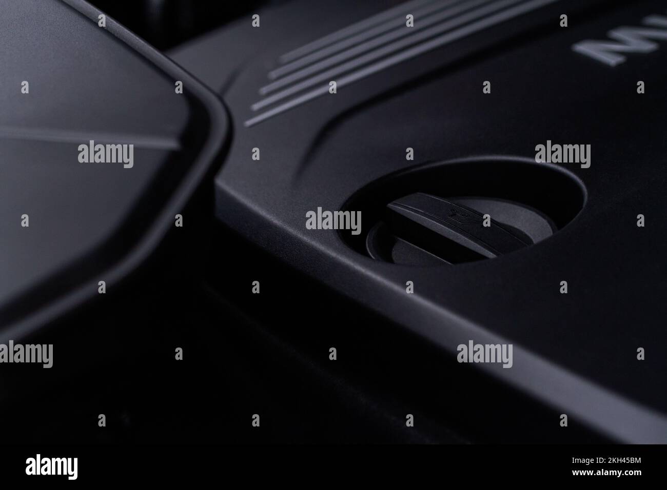 Closeup engine oil cap in engine room of a modern car. Oil cap on the