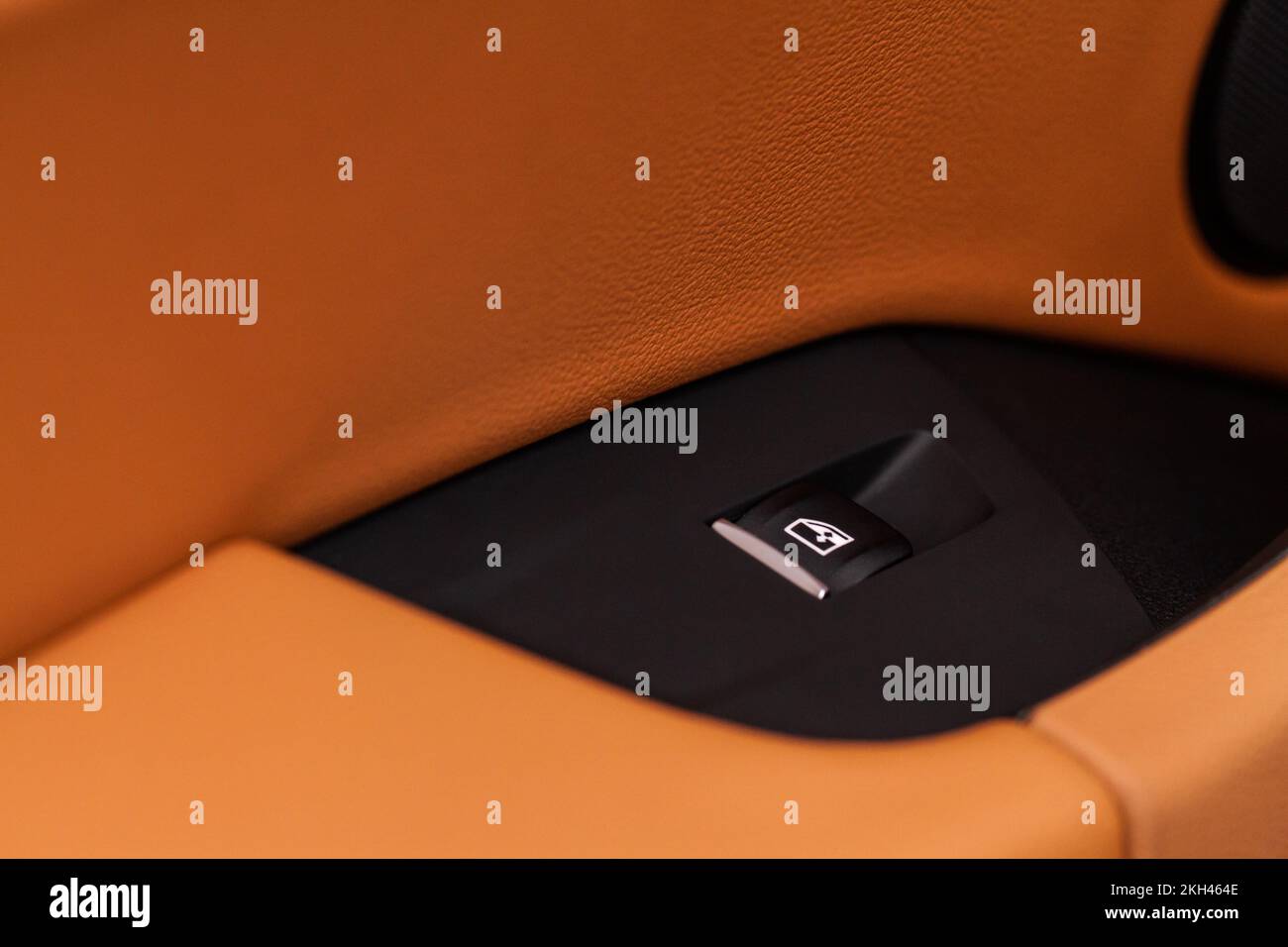 Close up view of button controlling window in modern car interior