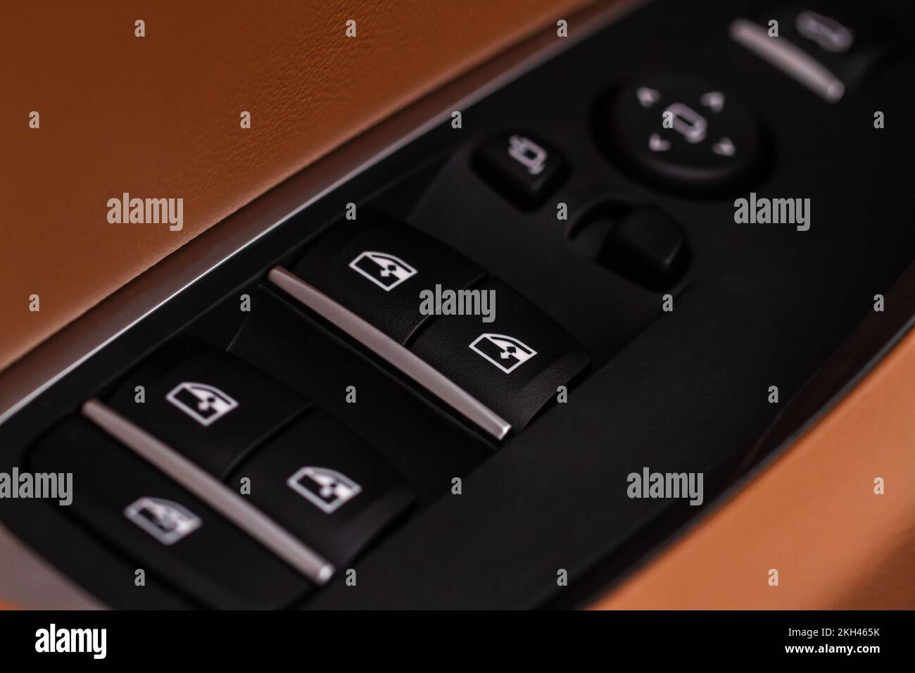 Close up view of button controlling window in modern car interior