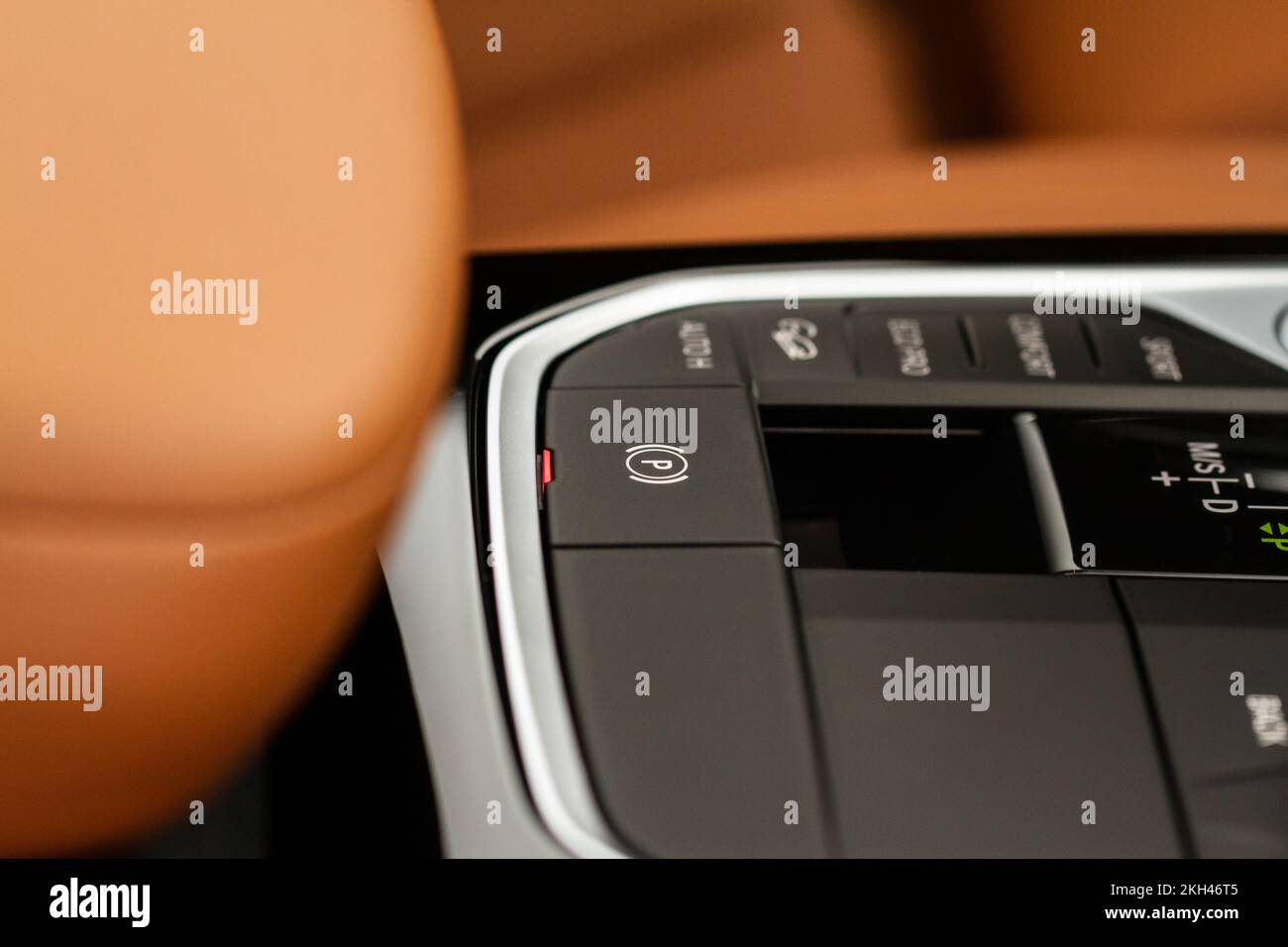 Parking brake of a modern car. Electronic handbrake. Modrn car hand brake, parking button. EPB