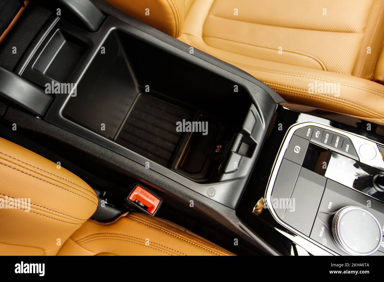 Car armrest opened. Opened armrest in the car for driver Stock Photo