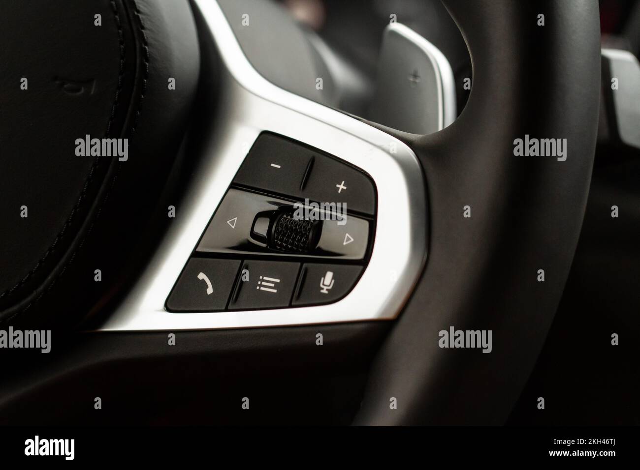 Call buttons on car steering wheel. Audio control buttons on the