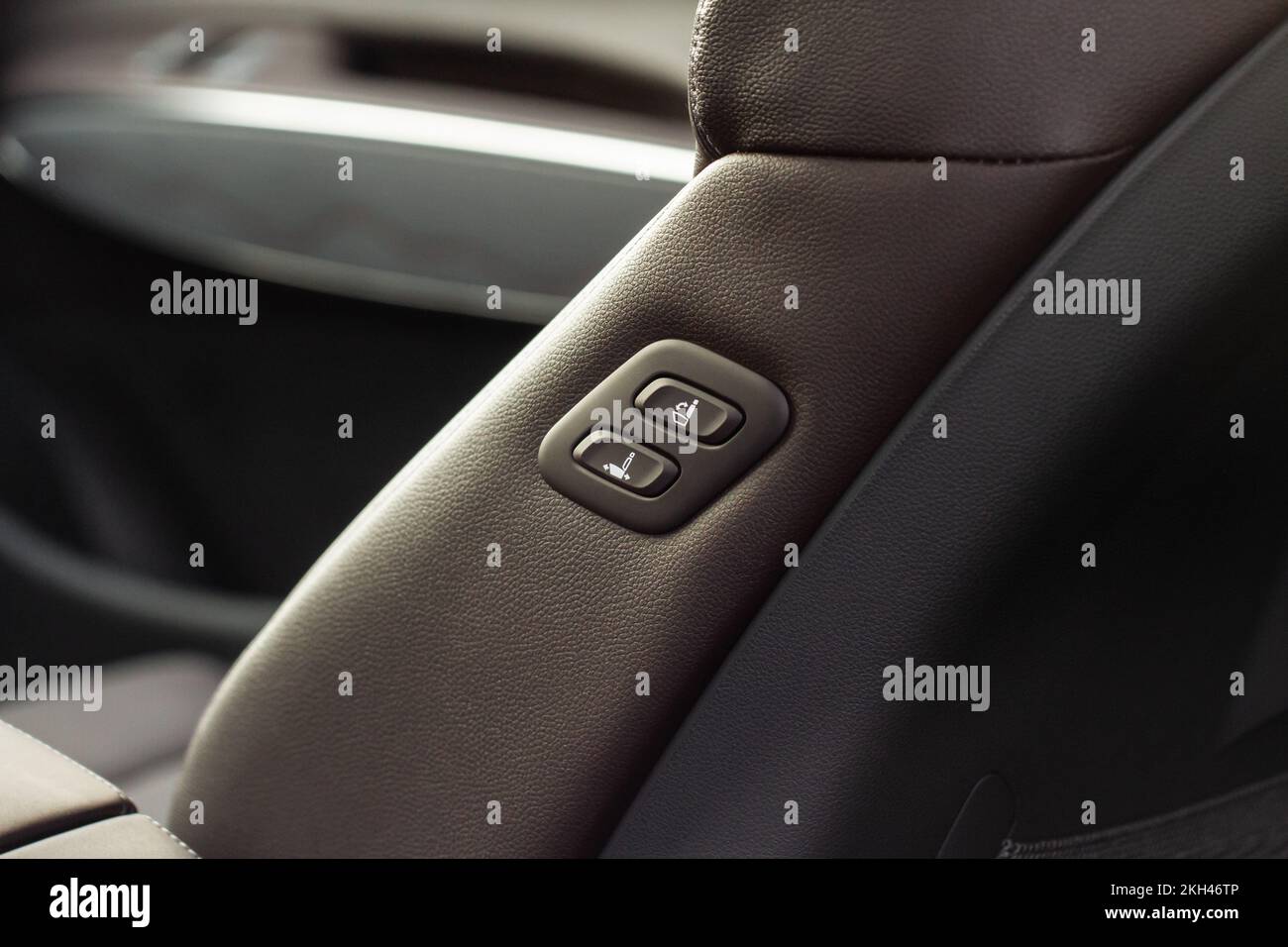 Electric car seat adjustment control panel close up view on the