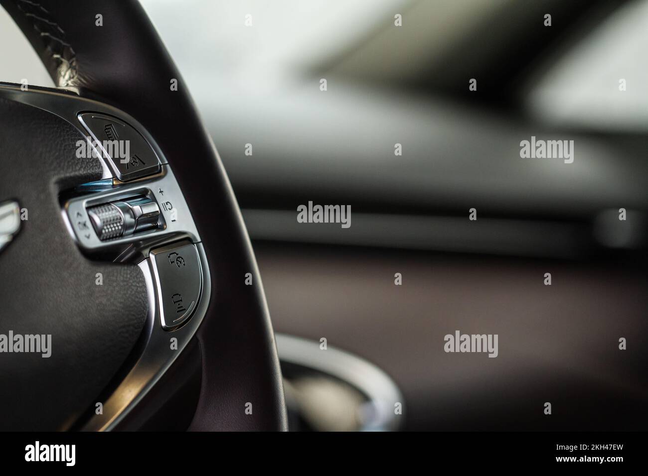 Cruise control switch closeup. Adaptive cruise control leaver. Cruise control on steering wheel. Stock Photo