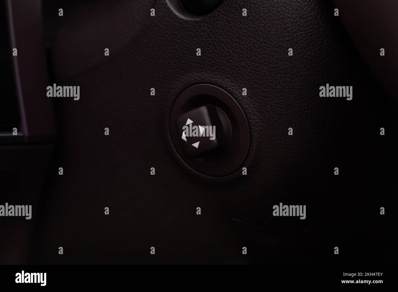 Adjustable steering wheel in modern car. Tilt and telescopic steering control lever. Steering