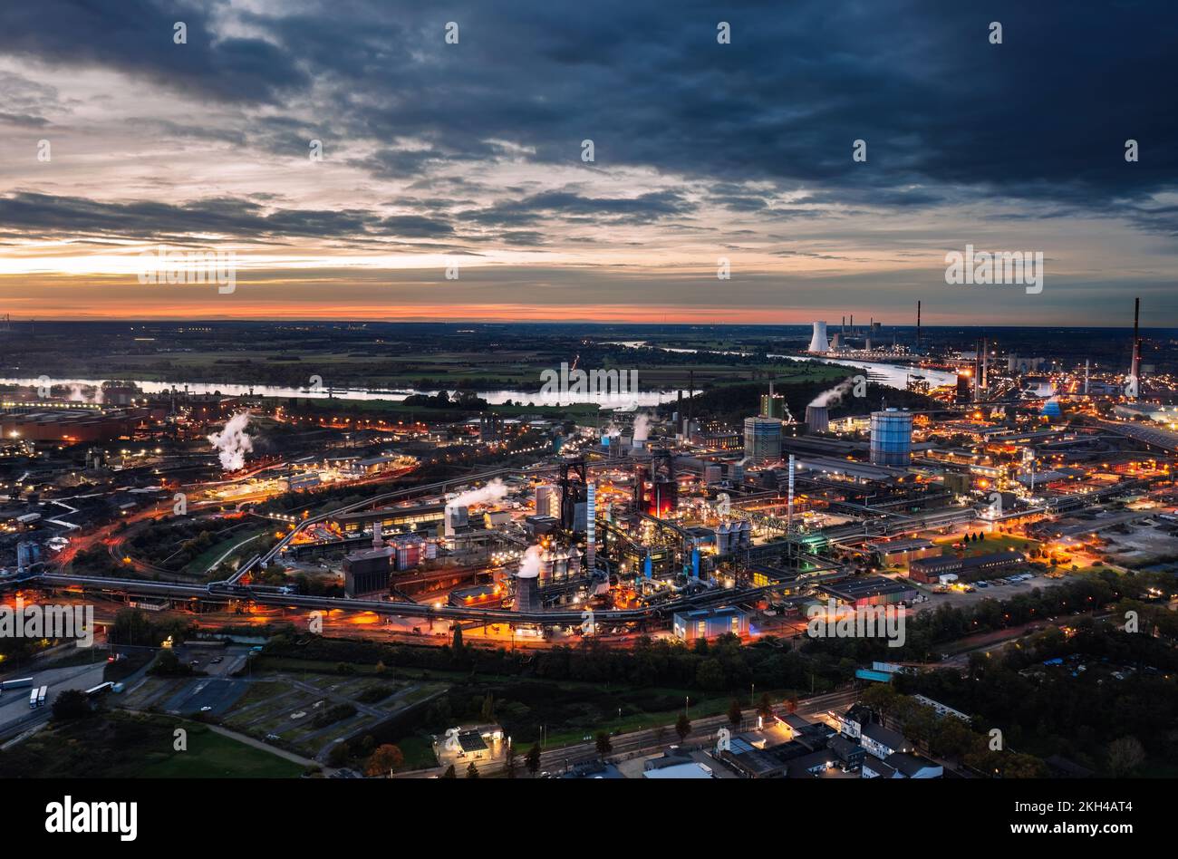 Duisburg, Germany, Industry of Ruhr: Aerial night skyline view of ThyssenKrupp steel production plant with industrial blast furnace Stock Photo