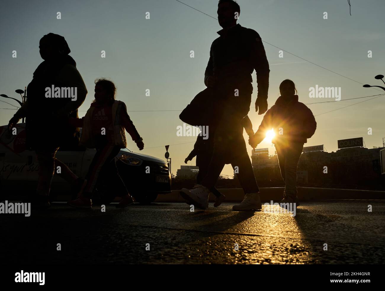 Bucharest, Romania - November 10, 2022: People cross the street in ...