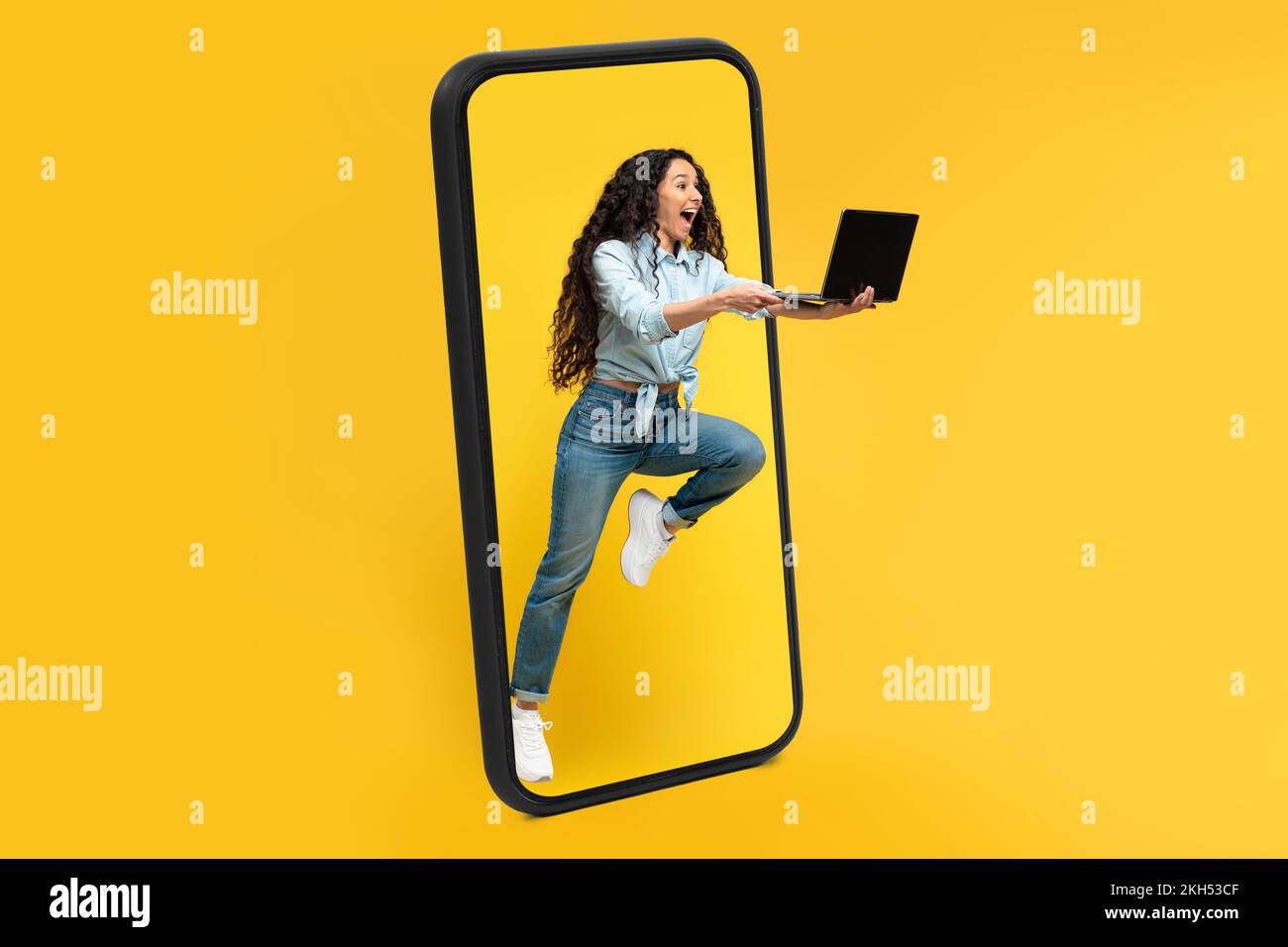 Happy excited millennial arab female with open mouth with laptop