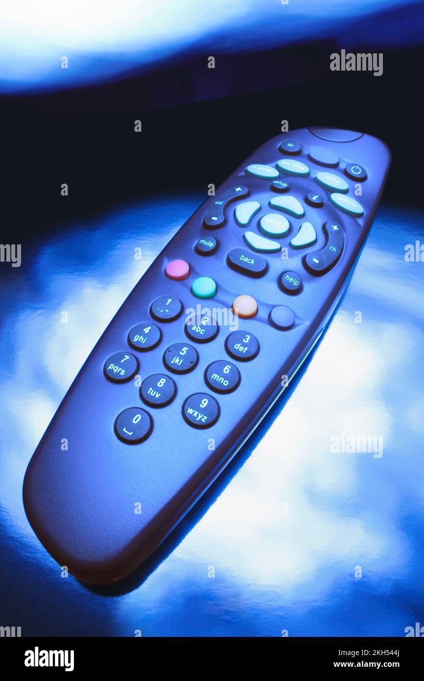 Remote Control on Blue Background Stock Photo
