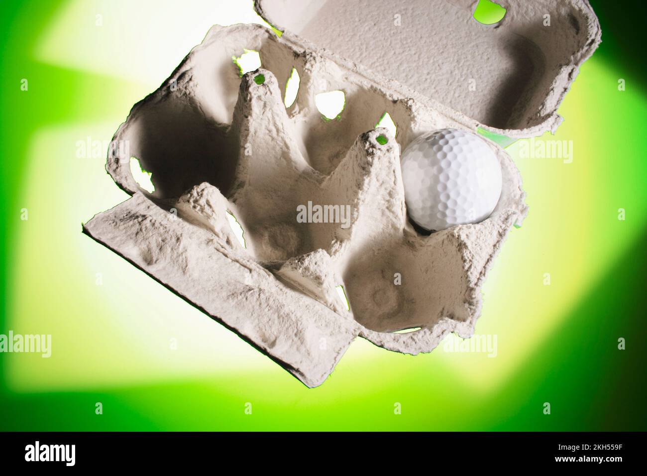 Golf Ball on Egg Carton Stock Photo Alamy