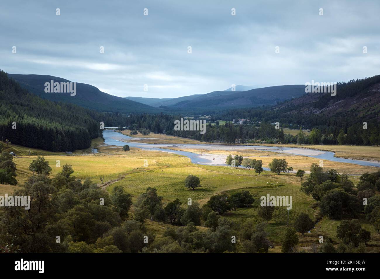 Autumn view of the river valley surrounded by mountains. Cairngorms, Highlands, Scotland. Stock Photo