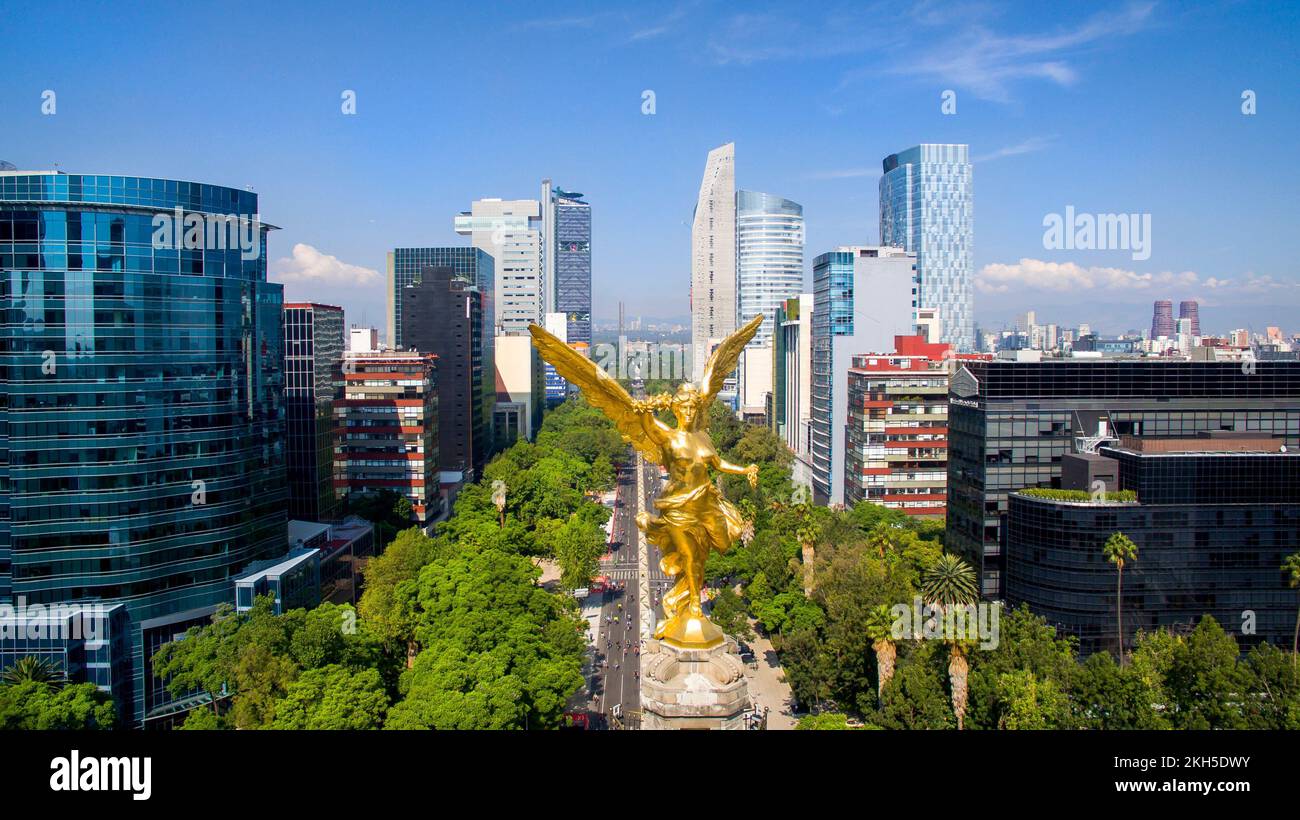 An aerial view of the angel statue and the city buildings in Mexico
