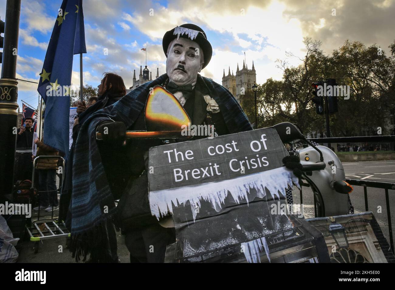 Westminster, London, UK. 23rd Nov, 2022. An anti Brexit protester in Charlie Chaplin outfit. A group of protesters from Sodem (Stand of Defiance European Movement) around 'Westminster Stop Brexit Man' Steve Bray rally with placards, banners and music against the effects of Brexit and against the current government outside Parliament in Westminster. The group of activists regularly protest in the capital. Credit: Imageplotter/Alamy Live News Stock Photo