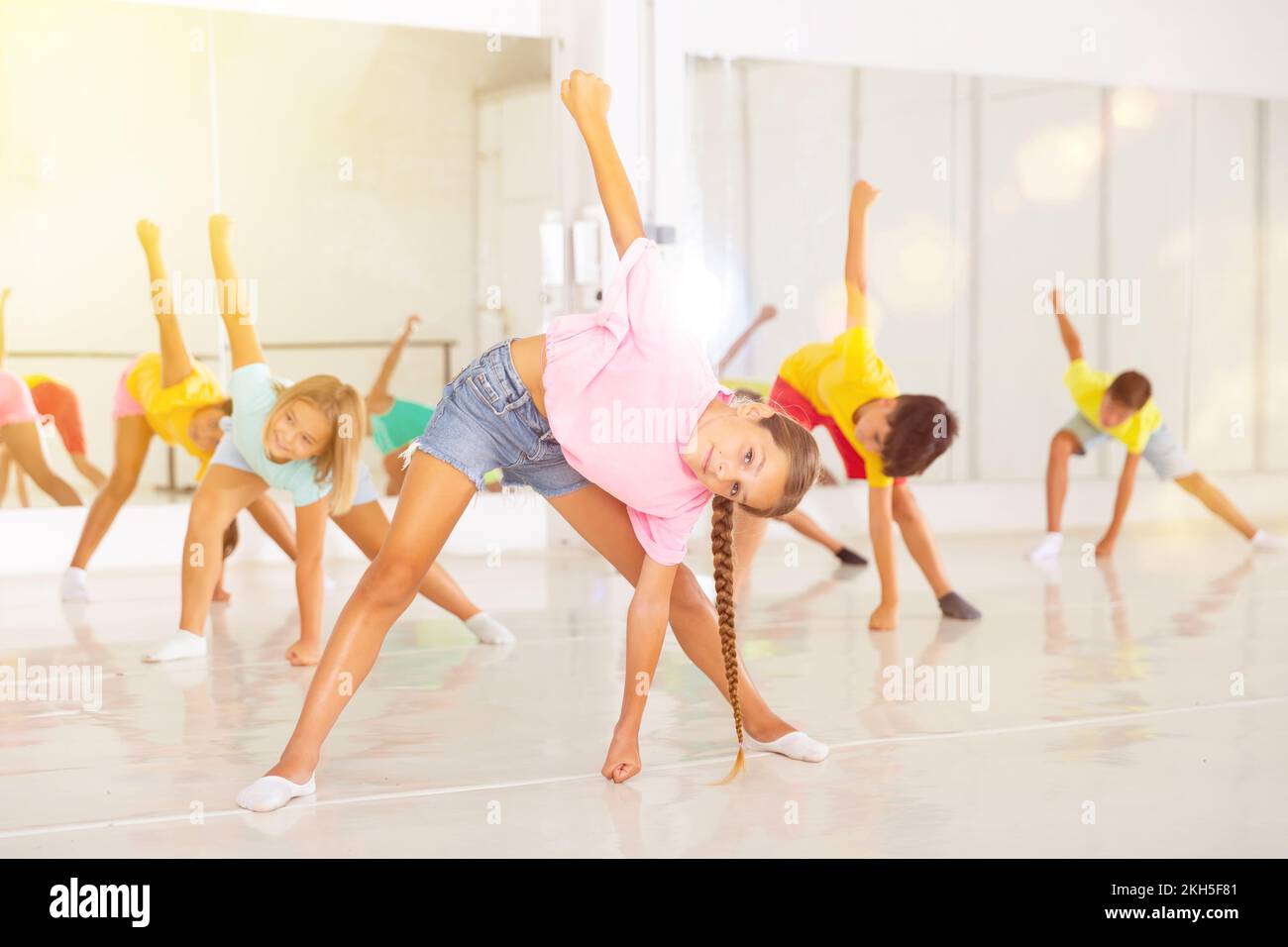 Children exercising dance moves together Stock Photo Alamy