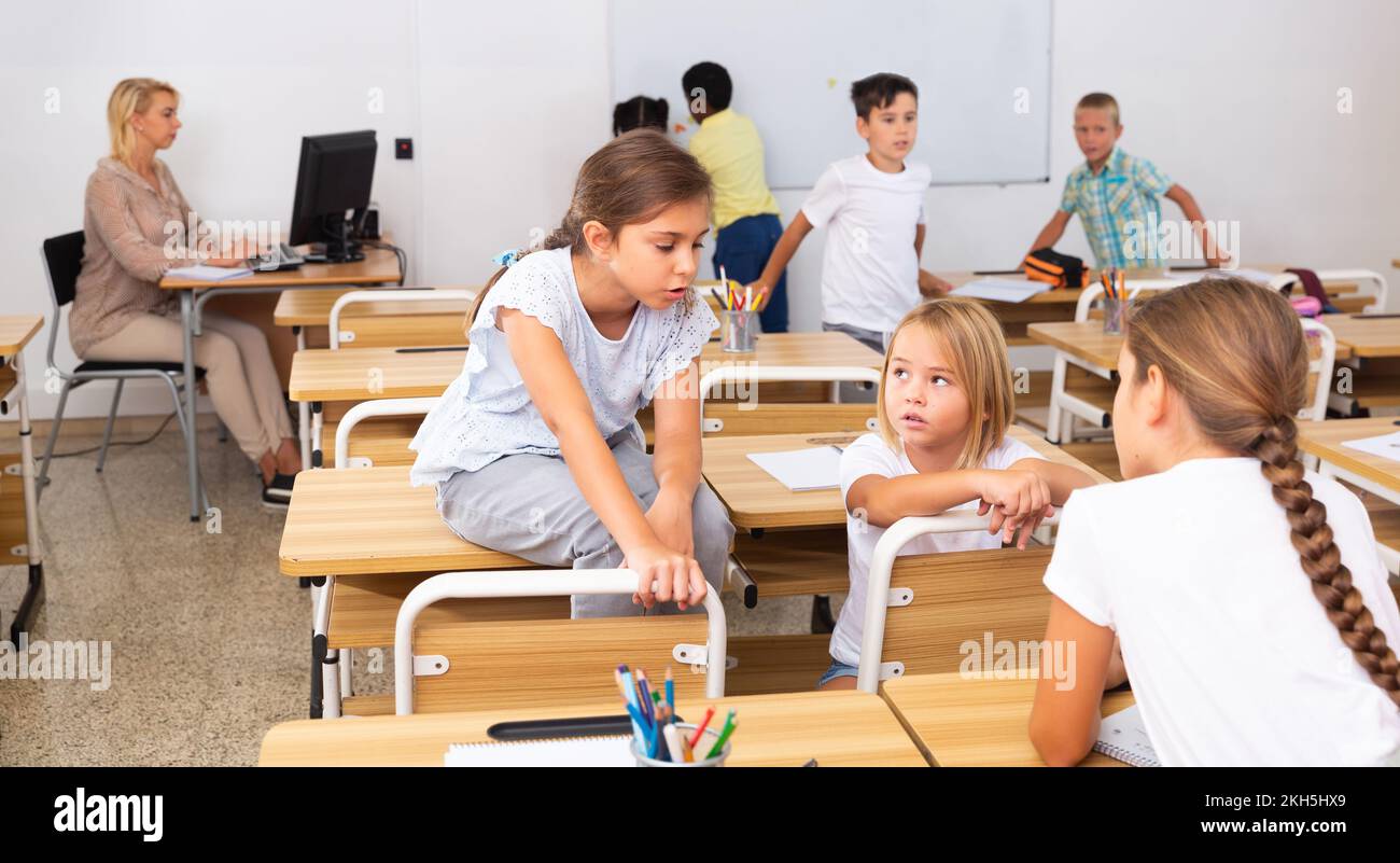 Kids pupils talking during recess between lessons Stock Photo