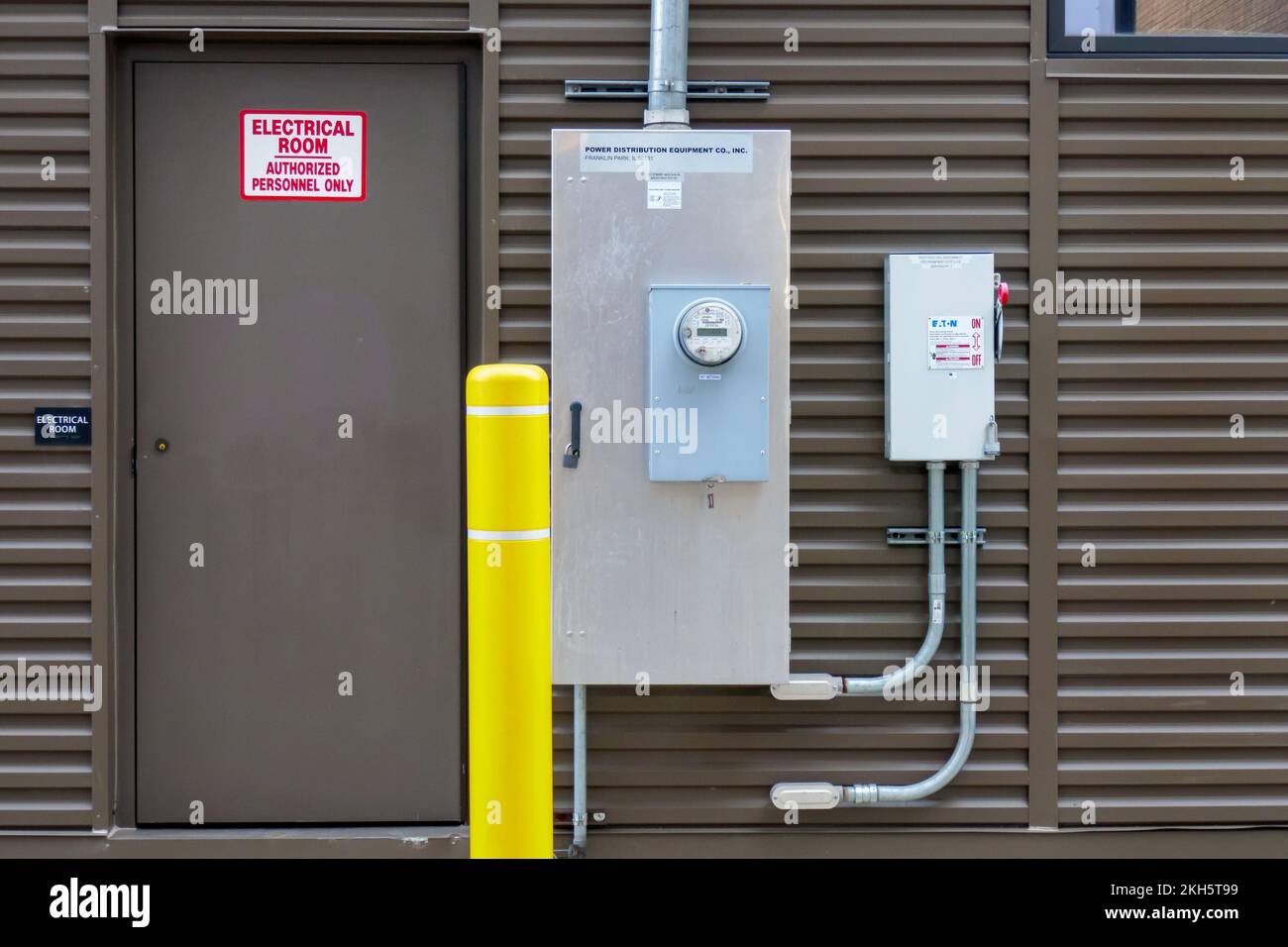 Door to electrical room and net metering electricity meter. Building