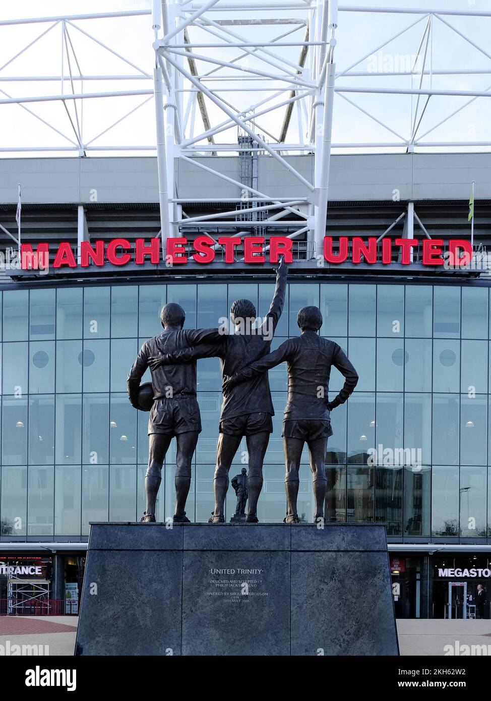 Trinity Statue of George Best, Bobby Charlton, and Denis Law outside of Manchester United FC, Old Trafford, Manchester, UK Stock Photo