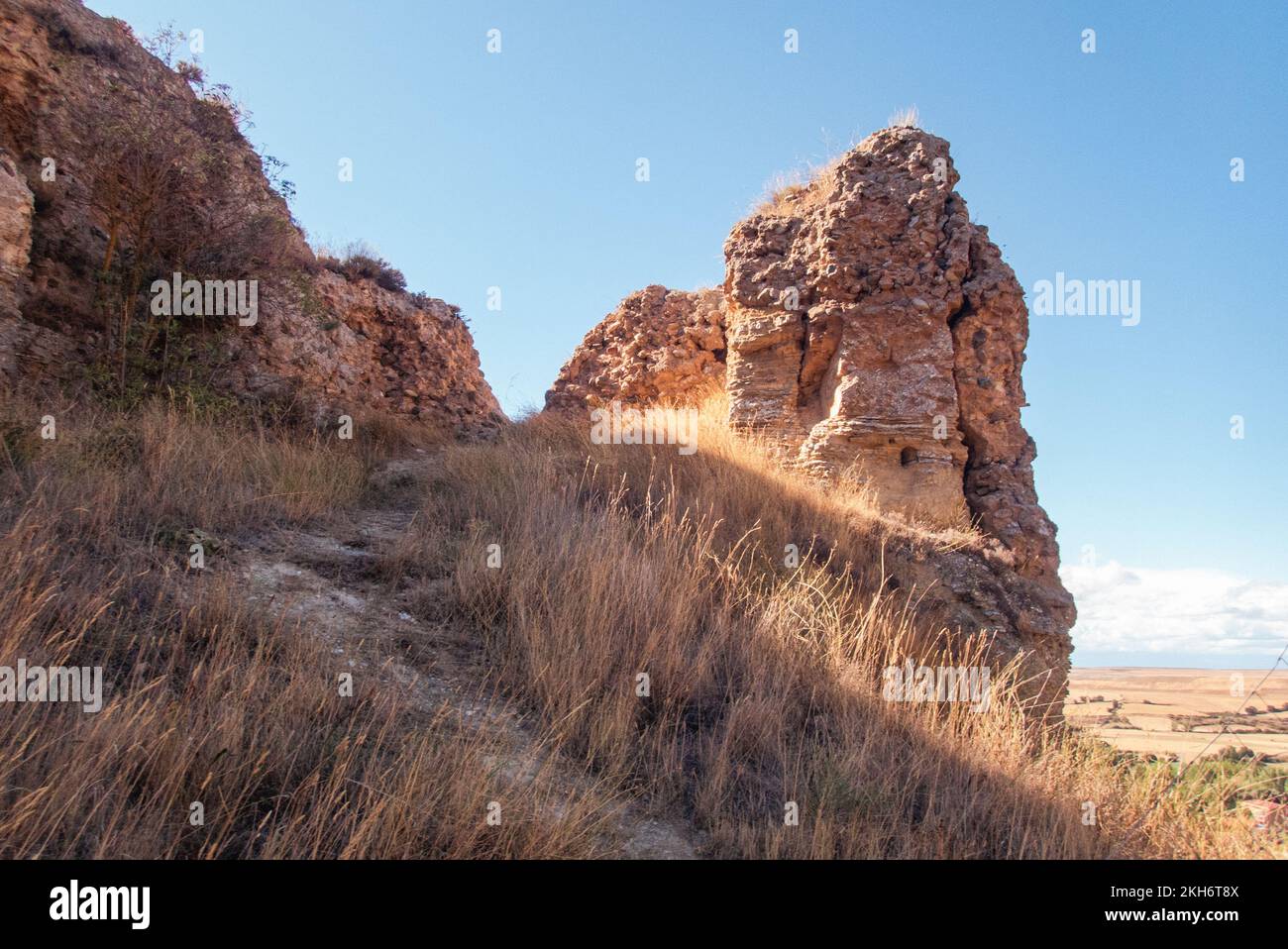 Visibly from afar: the castle hill of Belorado with its ruins of the medieval castle dominates the town at the former border between the historic kingdoms of Castile and Navarra Stock Photo