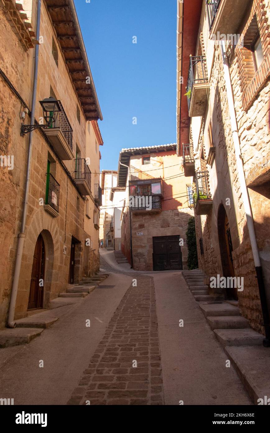The Camino de Santiago leading up a steep lane into the village of Cirauqui which was build in the Middle Ages on a strategic hilltop. Stock Photo