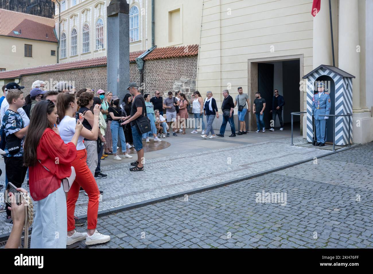 Prague, Czech Republic - 4 September 2022: Tourists taking pictures of a Prague Castle Guard Stock Photo