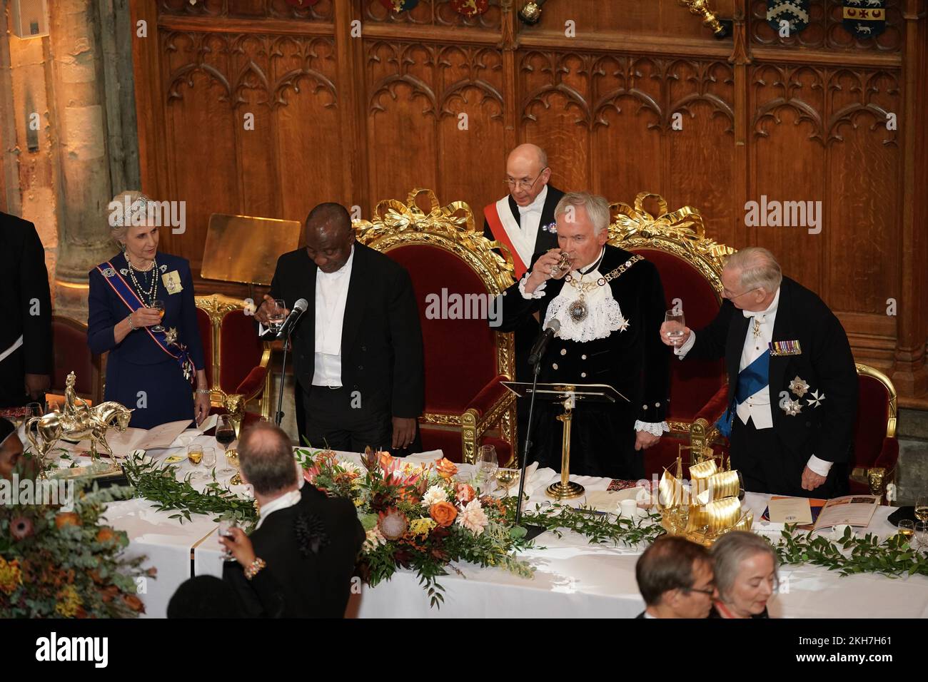 President Cyril Ramaphosa of South Africa raises a toast to the Lord Mayor of London, Nicholas Lyons, (second right) the Duke (right) and Duchess of Gloucester (second left) during a banquet at the Guildhall in London, given by the Lord Mayor and City of London Corporation, during his state visit to the UK. Picture date: Wednesday November 23, 2022. Stock Photo