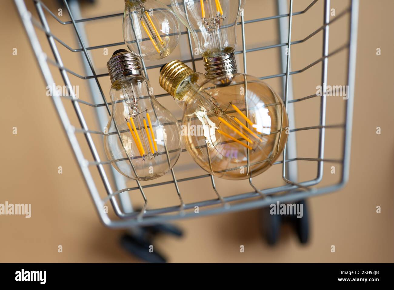 Purchase of electricity.lot of electric lamps in a shopping cart.Consumption and payment for