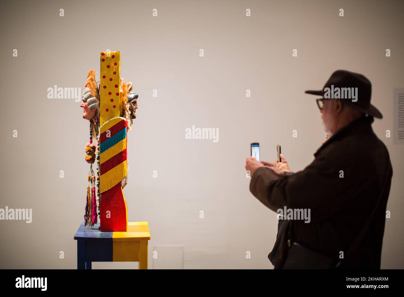 People take photographs of a sculpture entitled 'The Old Woman' during the inauguration of the exhibition of the Guatemalan artist Margarita Azurdia (1931 - 1998). The Reina Sofia Museum in Madrid inaugurated the exhibition entitled 'Margarita Rita Rica Dinamita' by the Guatemalan artist Margarita Azurdia (1931 - 1998), this exhibition of more than one hundred works is the first in Spain and in Europe by the artist, it presents the unique work of an emblematic figure with a restless, playful and transgressive spirit that permeates the Guatemalan artistic context of the second half of the 20th Stock Photo
