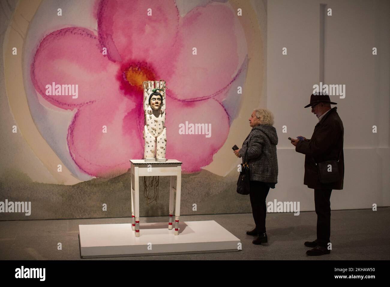 People observe a sculpture 'The Bride' during the inauguration of the exhibition of the Guatemalan artist Margarita Azurdia (1931 - 1998). The Reina Sofia Museum in Madrid inaugurated the exhibition entitled 'Margarita Rita Rica Dinamita' by the Guatemalan artist Margarita Azurdia (1931 - 1998), this exhibition of more than one hundred works is the first in Spain and in Europe by the artist, it presents the unique work of an emblematic figure with a restless, playful and transgressive spirit that permeates the Guatemalan artistic context of the second half of the 20th century. The exhibited w Stock Photo