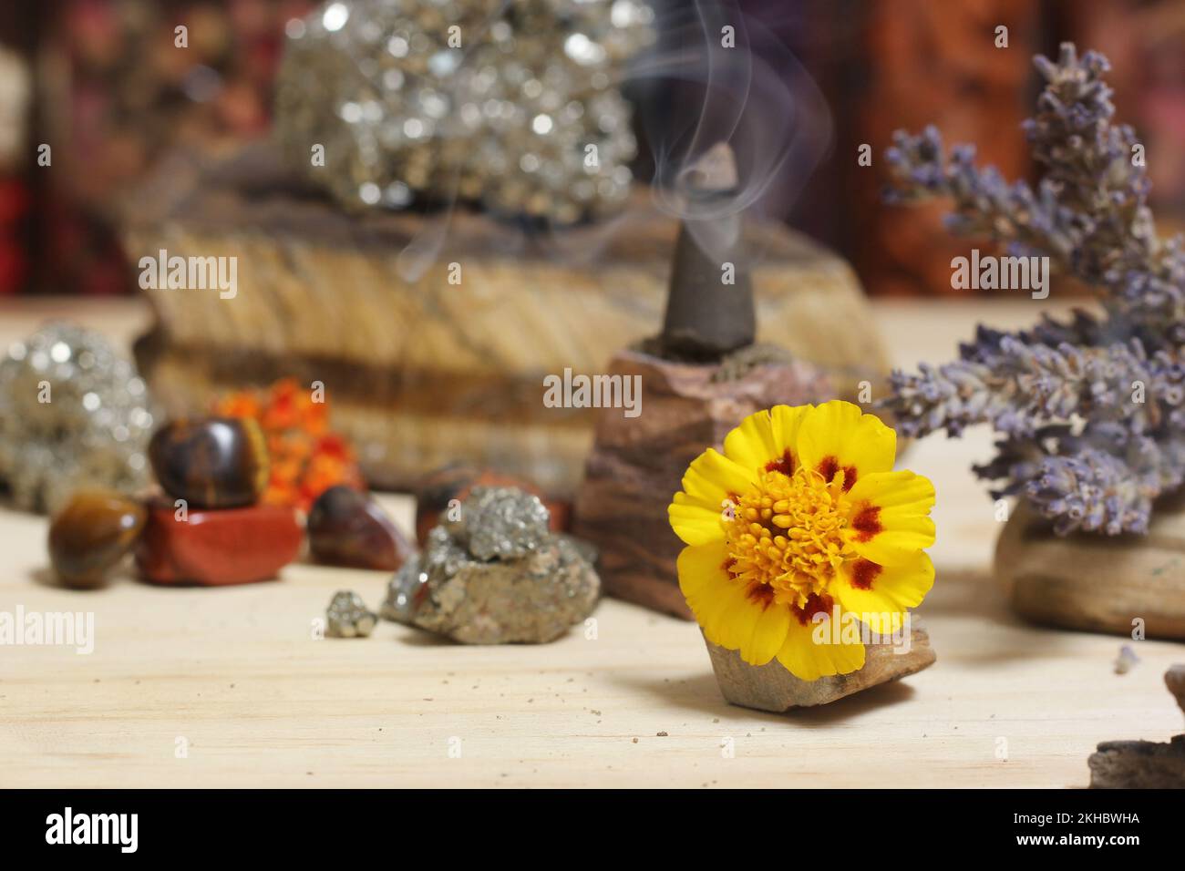 Incense Cone on Stone With Crystals and Flowers. Meditation Altar Stock Photo