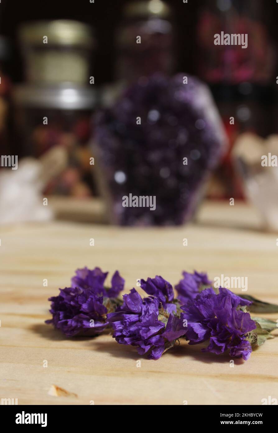 Amethyst Crystals With Flowers on Meditation Altar Stock Photo