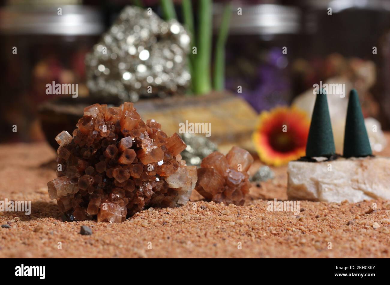 Chakra Stones With Aloe Vera Plants and Incense Cones on Australian Red Sand Stock Photo