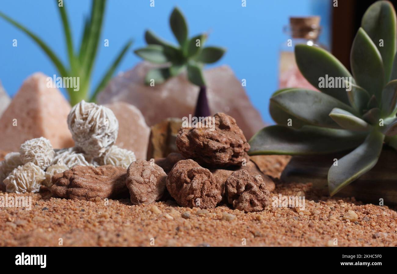 Desert Rose Rocks With Quartz Crystals on Australian Red Sand Meditation Altar Stock Photo