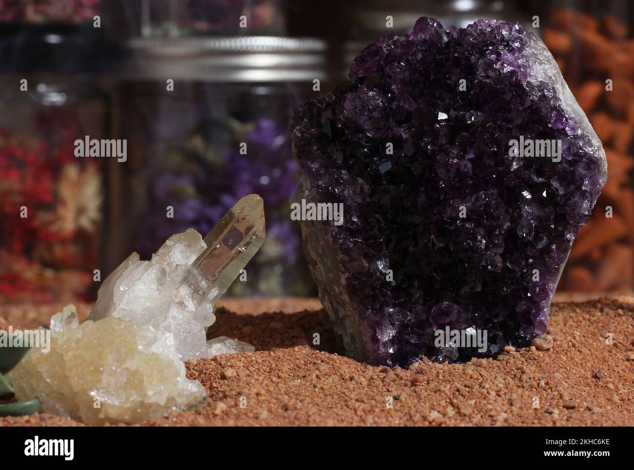 Amethyst Stone and Quartz Crystals on Australian Red Sand Meditation Altar Stock Photo