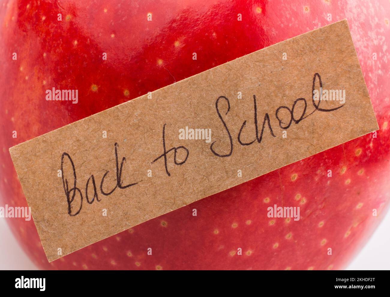 Back to school theme with a red apple Stock Photo Alamy
