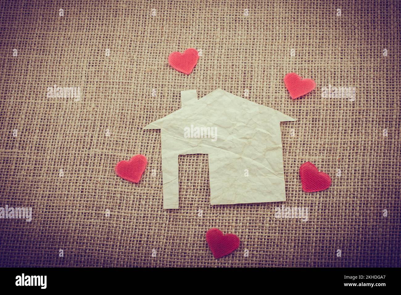 Heart shape around the paper house with a canvas background Stock Photo ...