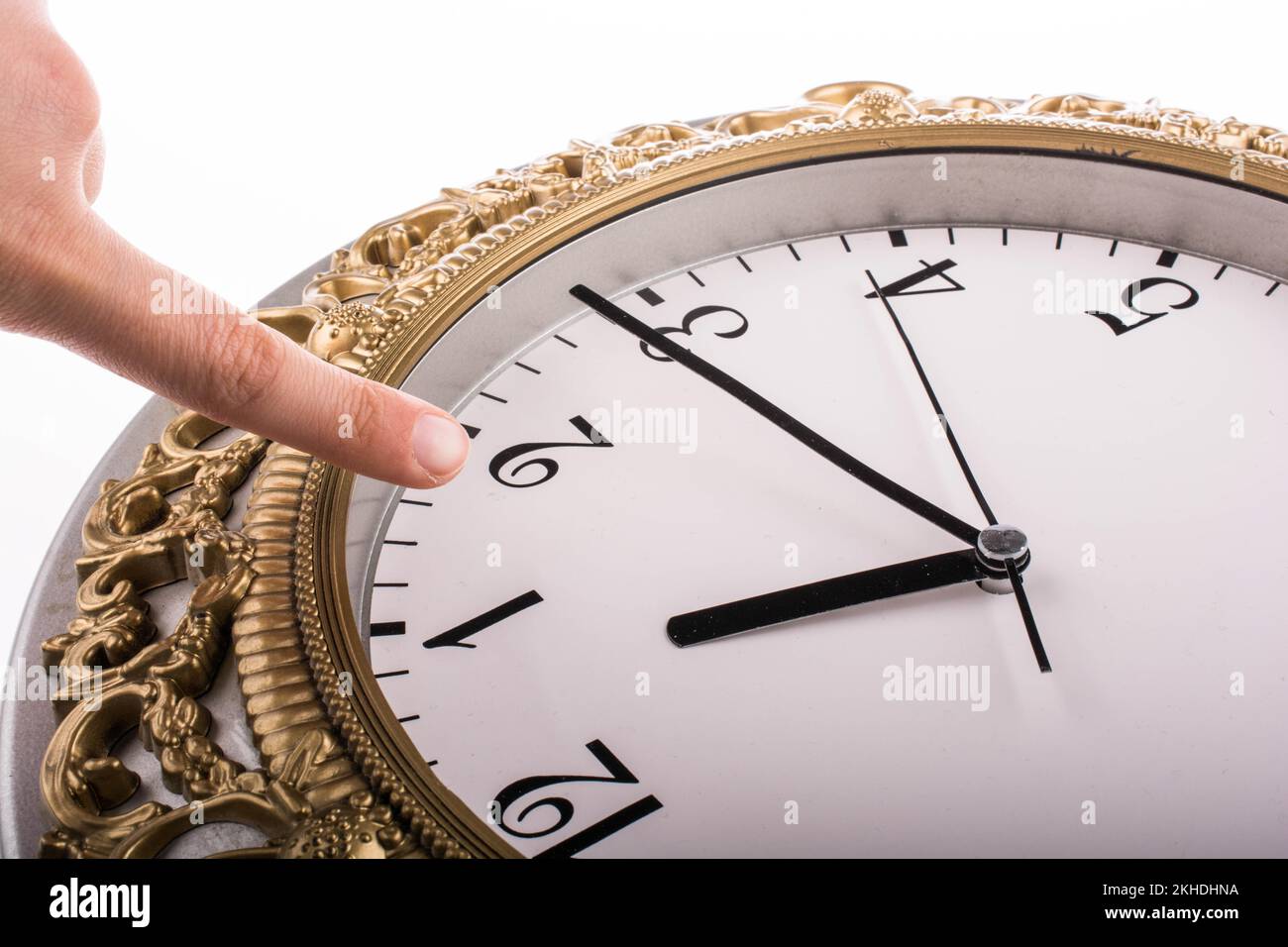 Finger pointing to clock and mechanism Stock Photo Alamy