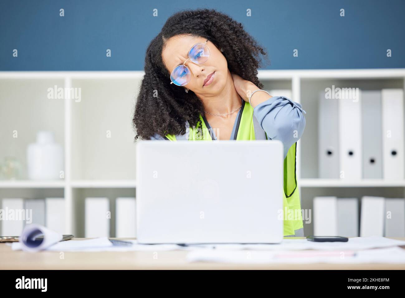 Stress, neck pain and black woman architect and engineer employee with office computer. Working, burnout and laptop work of engineering worker with Stock Photo