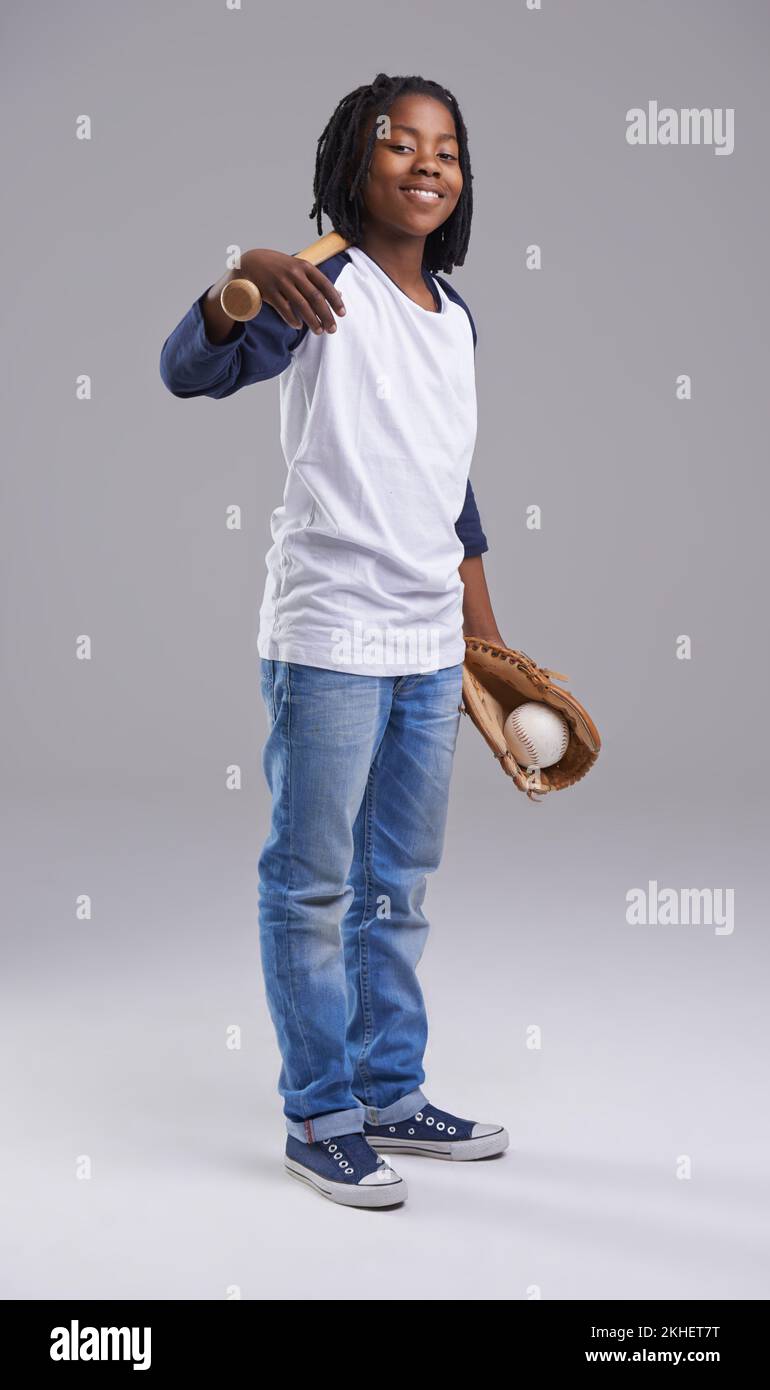 Let the games begin. Studio shot of a young boy with baseball gear. Stock Photo