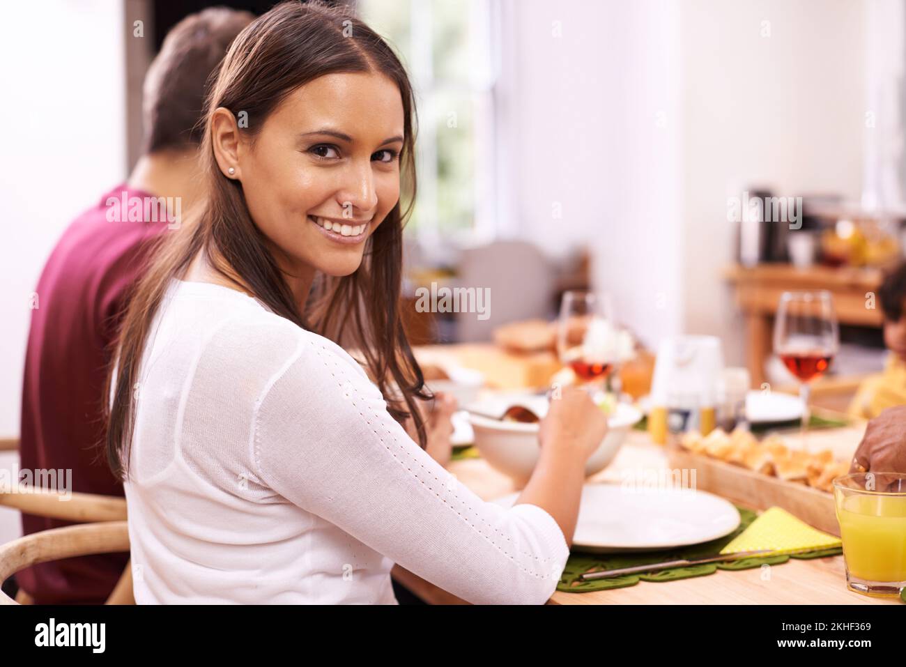 Good food equals good life. A happy couple enjoying a family meal around the table. Stock Photo