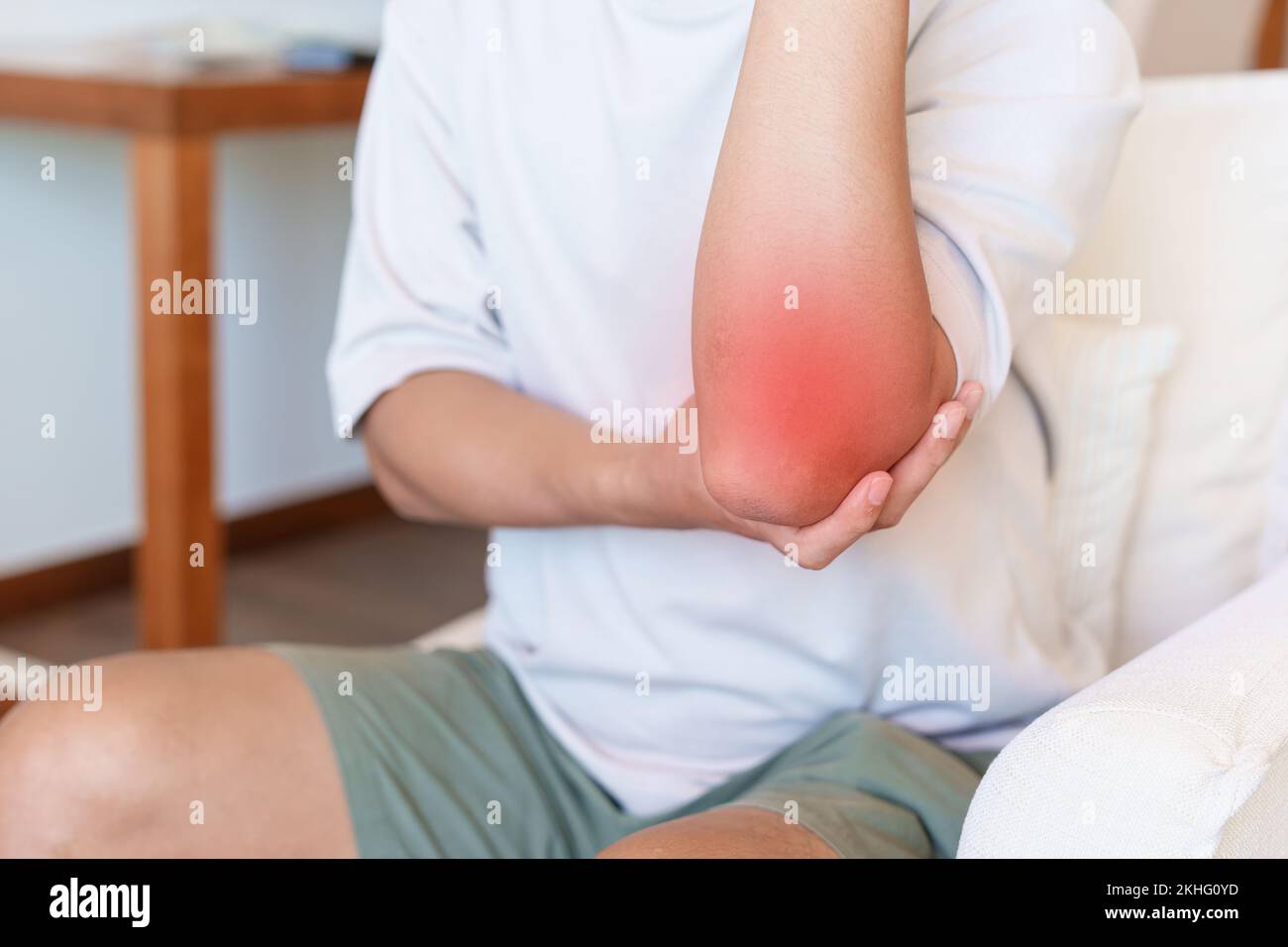 Man having elbow ache and muscle pain due to lateral epicondylitis or