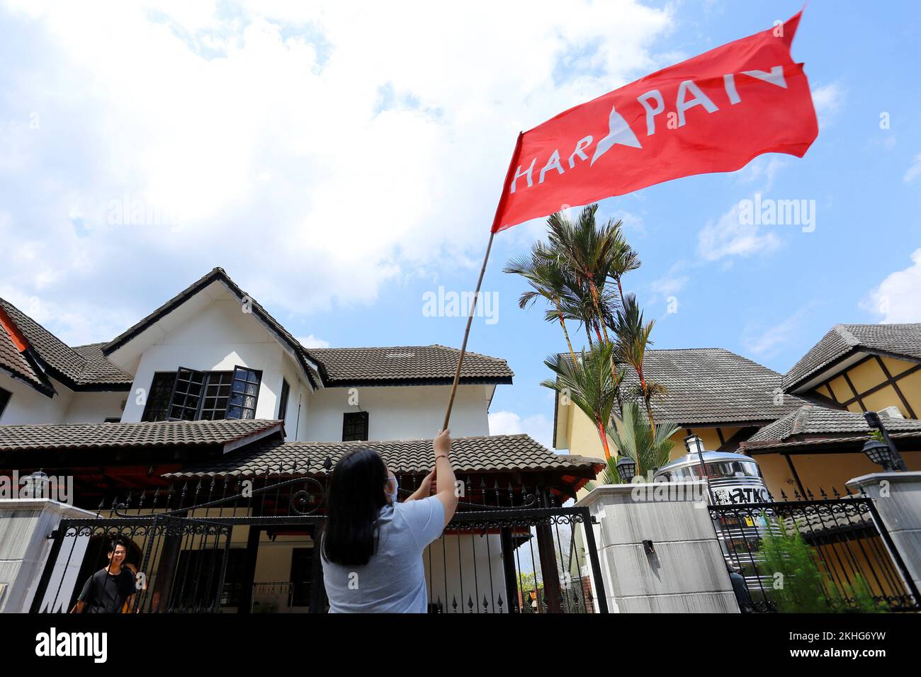 A supporter waves a flag of Pakatan Harapan in Kajang, Malaysia November 24, 2022. REUTERS/Lai Seng Sin Stock Photo