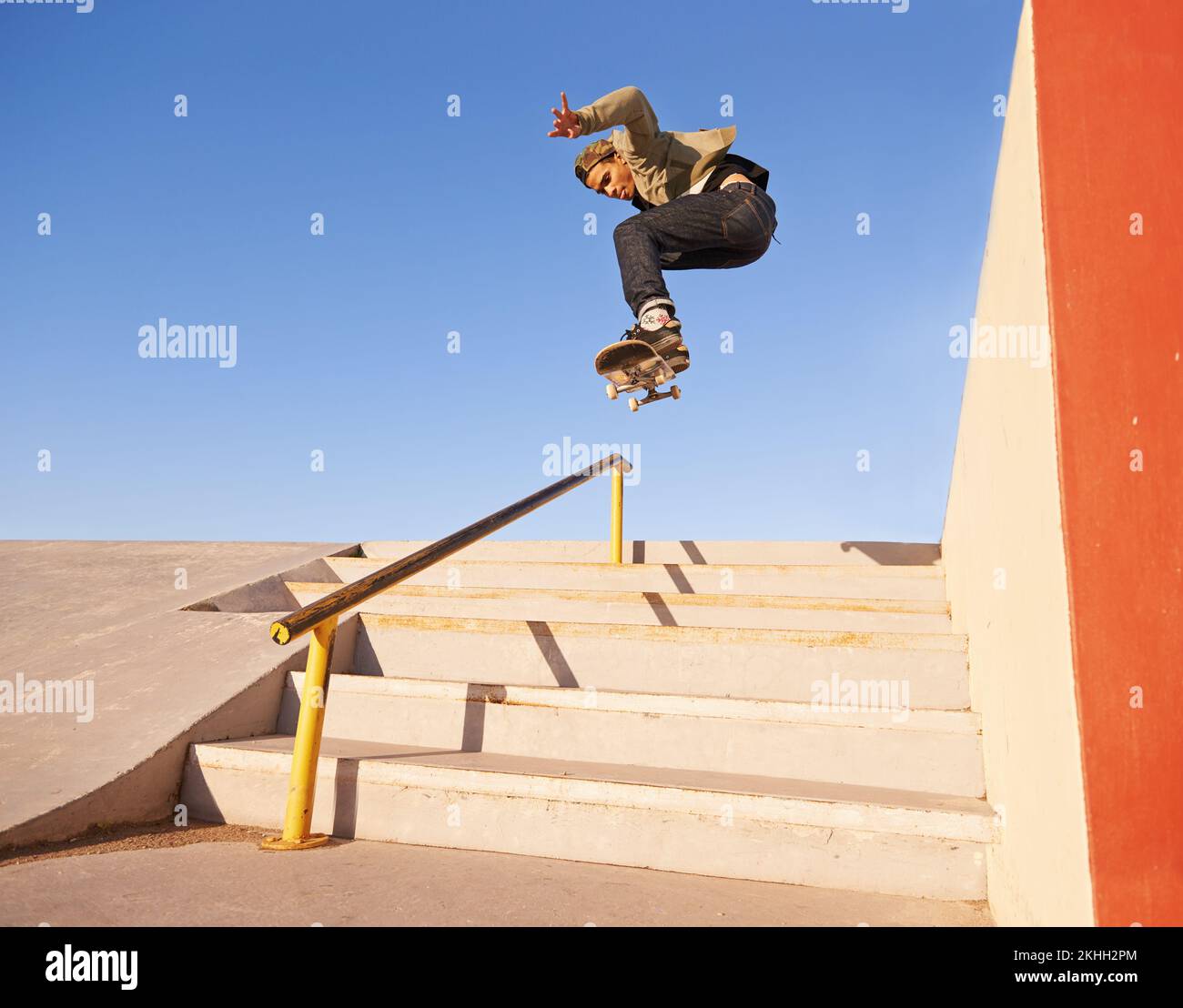 Grinding like a pro. a skateboarder performing a trick on a rail Stock