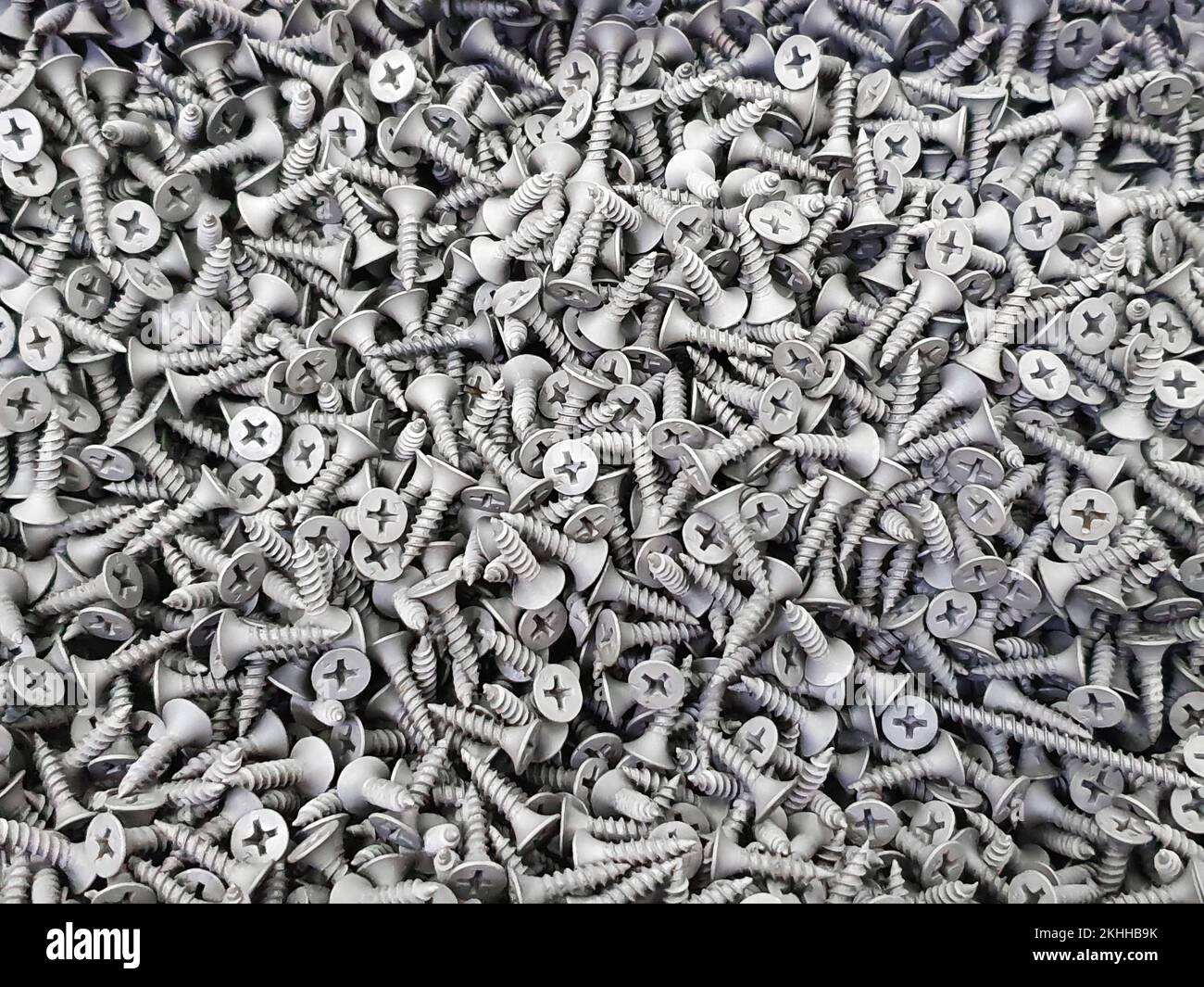 Gray short self tapping screws a lot. Texture background Stock Photo
